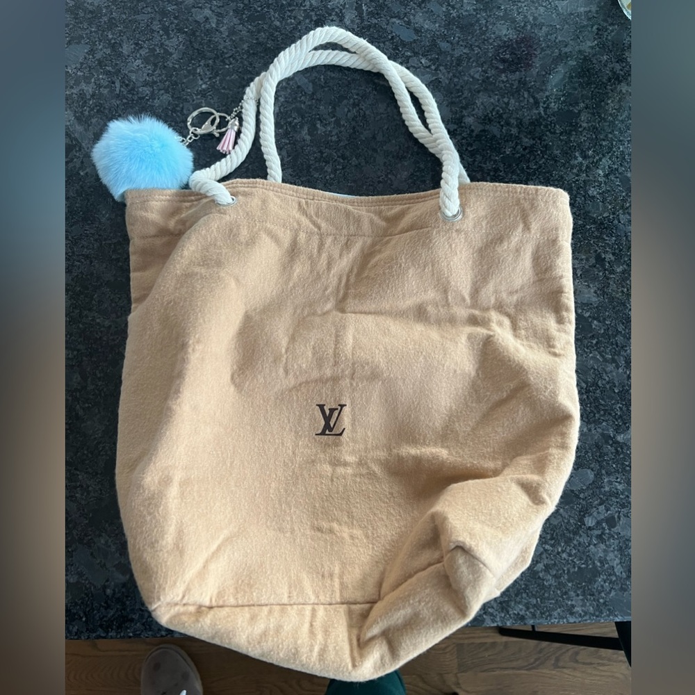 This bag is made from an authentic Louis Vuitton dust bag.